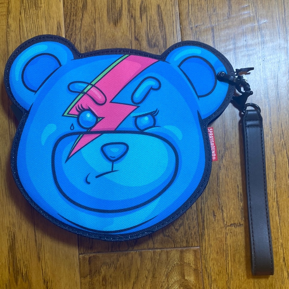 Bear shaped wristlet. Brand new has chunky zipper and sturdy hook it’s 9”by 8”
